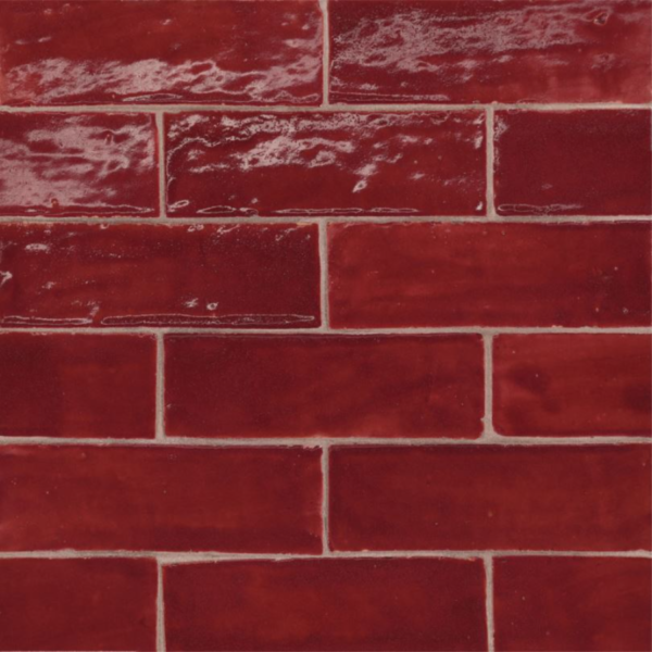 Close-up of handcrafted Zellige tiles showcasing their unique texture, vibrant glaze, and natural variations in color.