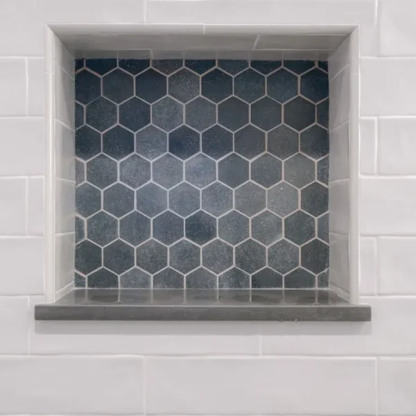 Shower niche with mosaic tile detail for shampoo and soap storage
