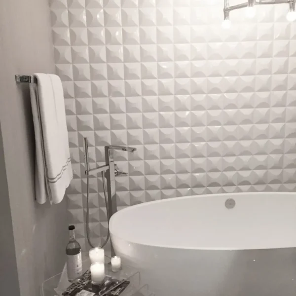 3D backsplash idea on the shower wall by Trendy Surfaces