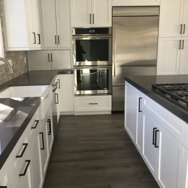 Modern kitchen with marble countertops and backsplash designed by Trendy Surfaces